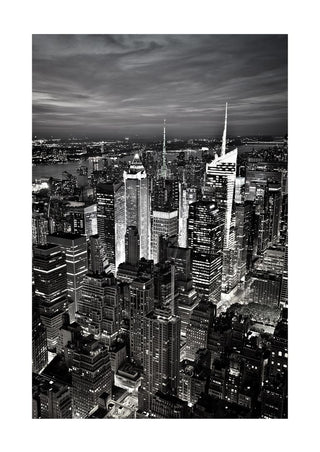 Black and white poster of New York City skyline with illuminated skyscrapers at night.