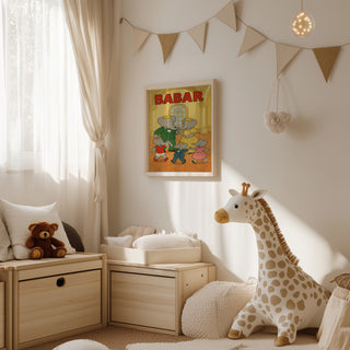 Framed Babar Dancing with Family poster hanging in a cozy nursery decorated with plush toys and soft furnishings.
