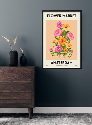 Flower Market Amsterdam poster featuring colorful flowers, framed and displayed on a modern wall above a wooden dresser.