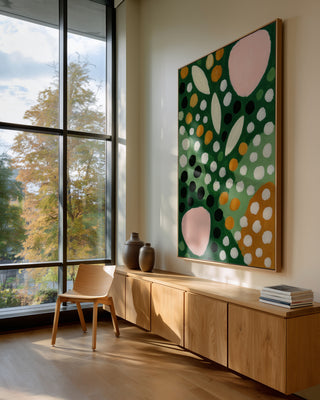 Large abstract artwork "Dots" by Martina Karlsson hangs above a wooden console in a modern, sunlit room.