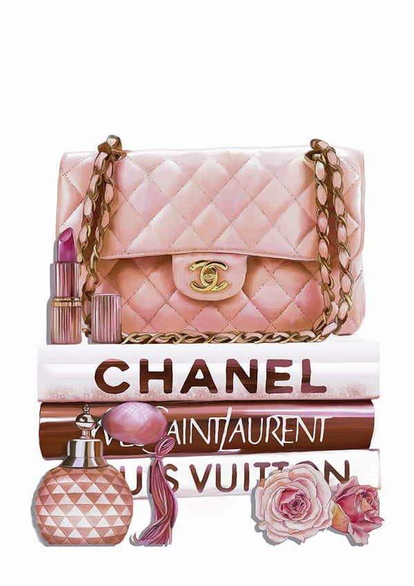 A pink Chanel bag, lipstick, and perfume on fashion books with roses.