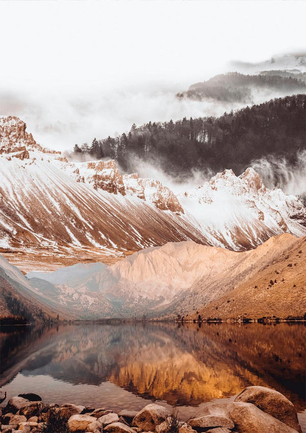 Poster of a tranquil lake reflecting snow-capped mountains and misty forest in warm, natural tones.