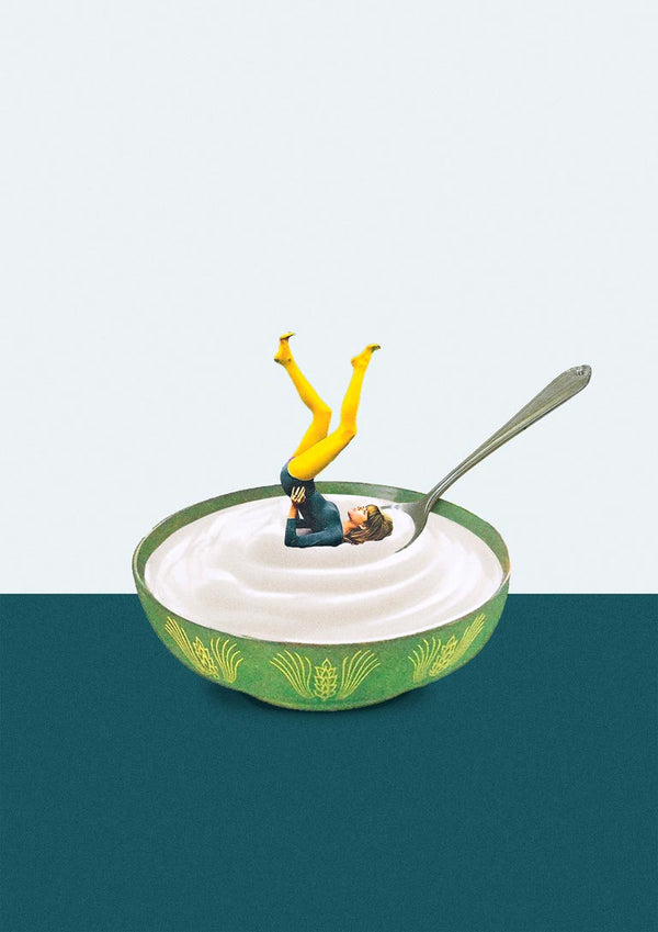 A miniature figure does a yoga pose in a bowl of yogurt with a spoon, promoting Yoga in my yogurt by Maarten Léon.