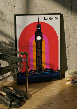 London 59 by Bo Lundberg in a black frame leaning against a concrete wall by a steel chair