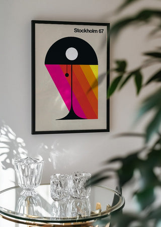 Stockholm 67 by Bo Lundberg in a black frame above a glass table with crystal glassware