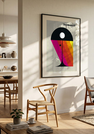 Stockholm 67 by Bo Lundberg in a black frame in a bright dining room with wooden chairs