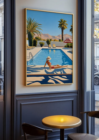 Poolside Afternoon by Elena Avanesova in an oak frame on a panelled café wall
