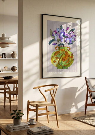 Lily by Marjorie Salvagni in a black frame in a bright dining room with wooden chairs
