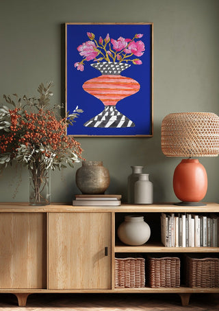 Lush Magnolia by Marjorie Salvagni above a wooden sideboard on a sage green wall