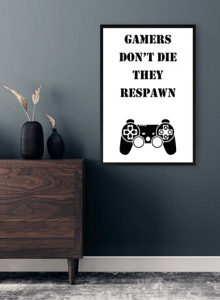 Framed Gamers Respawn Plakat on a wall, featuring "Gamers don't die they respawn" and a game controller graphic.