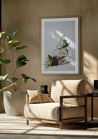 Letargo II by Rocio Montoya framed above a beige armchair beside a potted plant