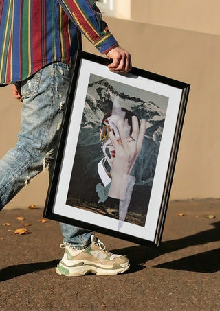 Birdie by Rocio Montoya carried in a black frame along a sunny street