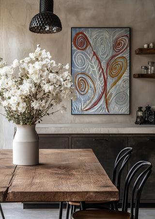 Coil by Fábio Diniz Art in a black frame above a rustic table with white flowers