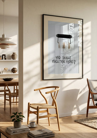 Vad skulle Macgyver gjort? by Grafik bageri in a black frame in a bright dining room with wooden chairs