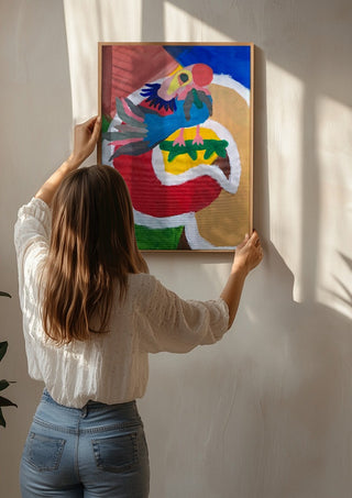 Befriad fågel by Hampus Nerén being hung on a sunlit wall