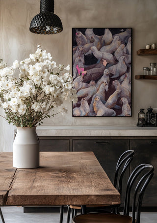 One with Nature by Daukantė in a black frame above a rustic table with white flowers