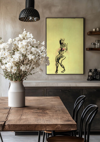 Gift by Alice Ruja in a black frame above a rustic table with white flowers