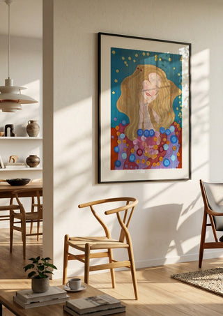 The dreamer by Gerard Ceulemans in a black frame in a bright dining room with wooden chairs