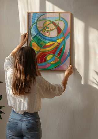 Embrace by Gerard Ceulemans being hung on a sunlit wall