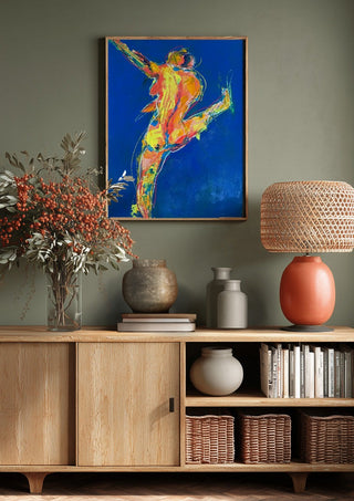 Blue Dancer by René J above a wooden sideboard on a sage green wall