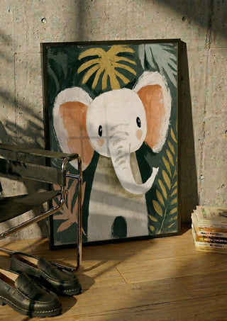 Jungle Elephant by Decker Studios in a black frame leaning against a concrete wall by a steel chair