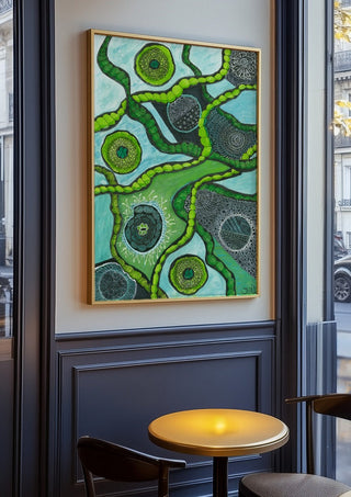 Green Cells by JHN.ByHjort in an oak frame on a panelled café wall