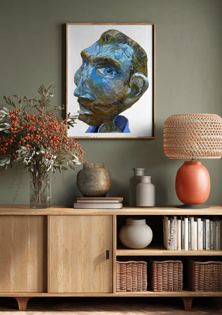 Vincent by Simone Hübner-Schwinn above a wooden sideboard on a sage green wall