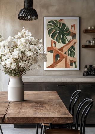 The Green Staircase by Matthews Gallerie in a black frame above a rustic table with white flowers