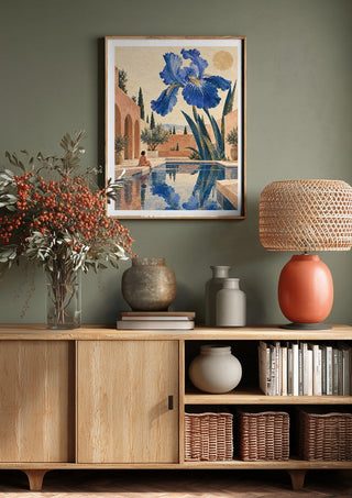 The Blue Garden by Matthews Gallerie above a wooden sideboard on a sage green wall