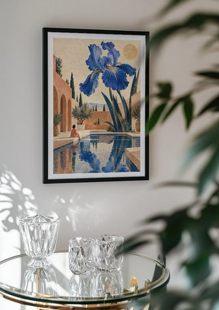 The Blue Garden by Matthews Gallerie in a black frame above a glass table with crystal glassware