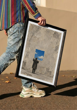 Borrowed Sky by Matthews Gallerie carried in a black frame along a sunny street