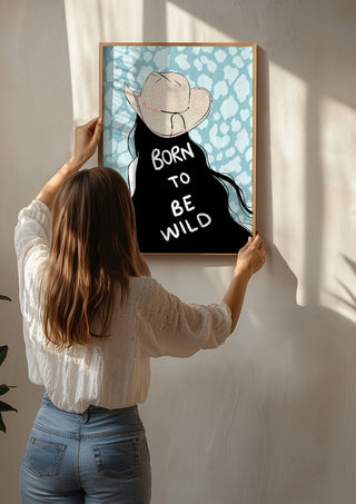 Born to be wild by Lisen Vennesland being hung on a sunlit wall