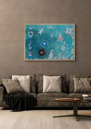 Give Peace a Chance by Andreas Pohle in a light wood frame above a grey sofa with cushions