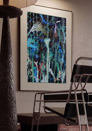 Mystical Garden by Andreas Pohle framed in a dim room beside a tubular steel chair