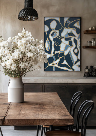 Erotica by Andreas Pohle in a black frame above a rustic table with white flowers