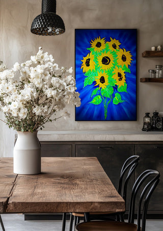 Sunflowers by Walter Zettl in a black frame above a rustic table with white flowers