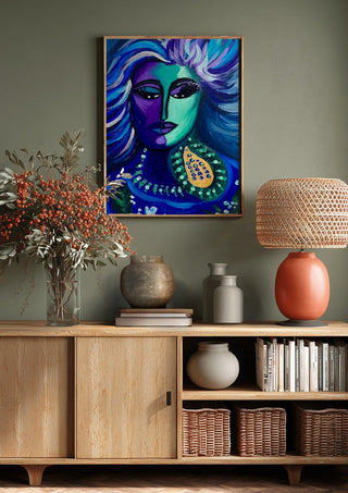 Blue Muse by Da Winters above a wooden sideboard on a sage green wall