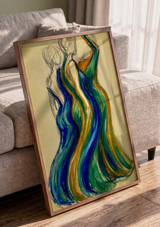 Two Gowns by Da Winters in a walnut frame leaning against a grey sofa