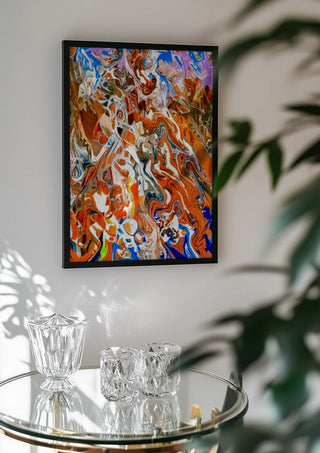 Ember Current by Da Winters in a black frame above a glass table with crystal glassware