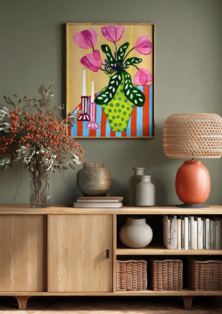 Flower Power by LGDyrby above a wooden sideboard on a sage green wall
