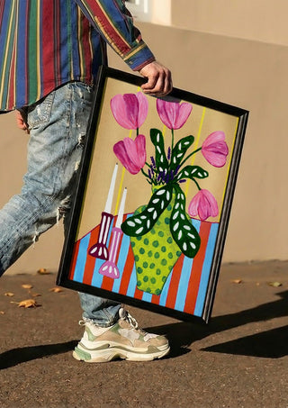 Flower Power by LGDyrby carried in a black frame along a sunny street