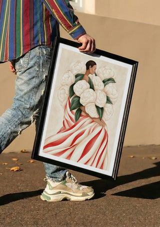 White Peonies by Martina Karlsson carried in a black frame along a sunny street