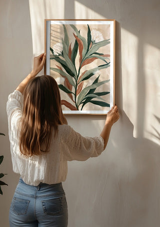 Sage and Rust by Martina Karlsson being hung on a sunlit wall