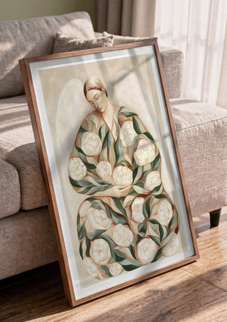 Peony Angel by Martina Karlsson in a walnut frame leaning against a grey sofa