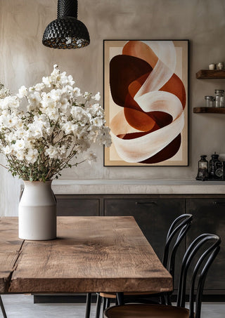 Ribbon in Rust by Martina Karlsson in a black frame above a rustic table with white flowers