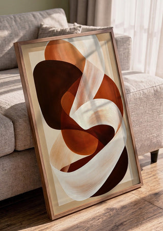 Ribbon in Rust by Martina Karlsson in a walnut frame leaning against a grey sofa