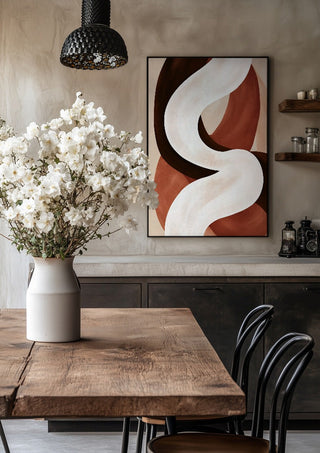 Curve in Cream by Martina Karlsson in a black frame above a rustic table with white flowers