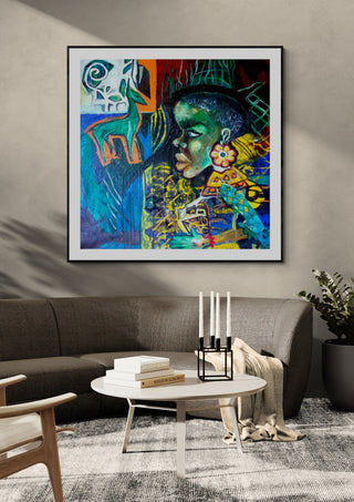 Black woman by Ralu in a black frame above a grey sofa with a round coffee table and candlesticks