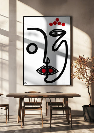 Face by RA hanging above a wooden dining table in warm sunlight