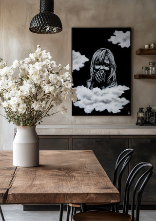 innocence by Sofia de Lemos in a black frame above a rustic table with white flowers